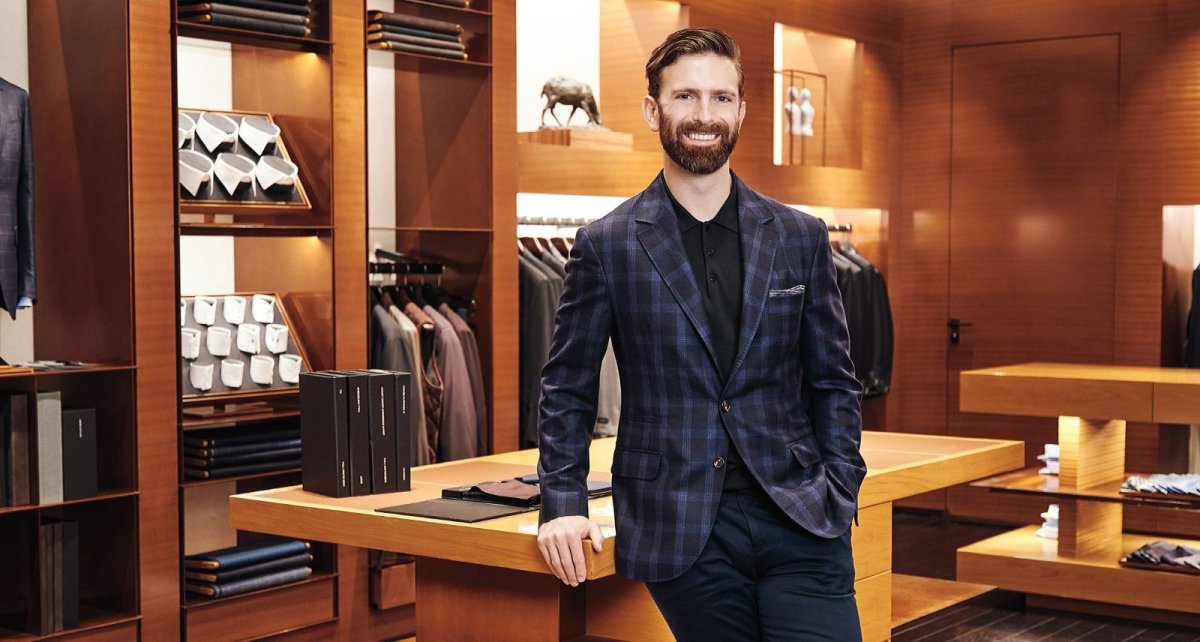Ian Rosen wearing suit in menswear retail location