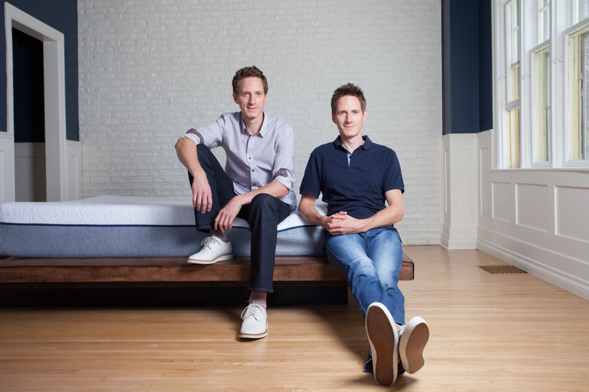 Andy Prochazka and Sam Prochazka lean on a GoodMorning.com bed