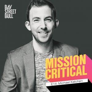 A black and white photo of Michael Katchen, CEO of Wealthsimple, in a blazer and t-shirt. There is Bay Street Bull: Mission Critical branding