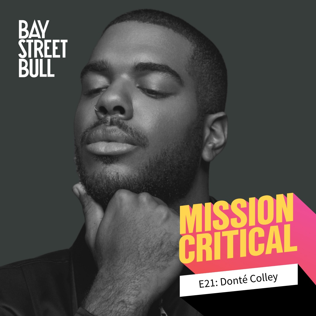 A black and white photo of Donté Colley, Content Creator, with his chin resting on his hand and his eyes closed. Bay St. Bull and Mission Critical branding.
