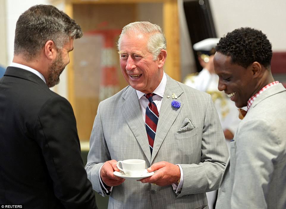 Daniel Lewis alongside King Charles III.